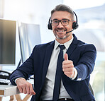 Thumbs up, yes and success deal for a call center agent with contact us and happy about telemarketing. Portrait of a CRM manager or customer service employee smiling due to good business