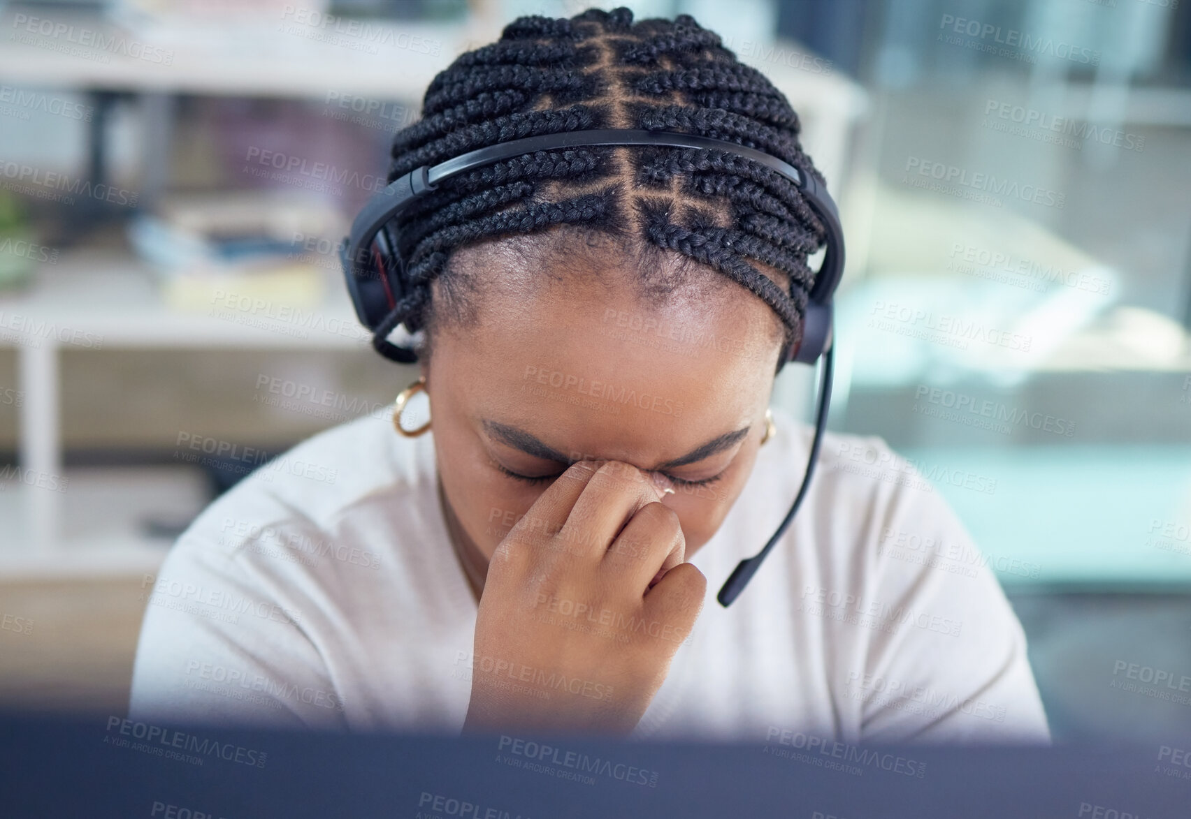 Buy stock photo Stress, burnout and sad call center agent with a headache and office overworked sitting in an office. Frustrated, sick or ill young black woman customer service employee with pain or migraine