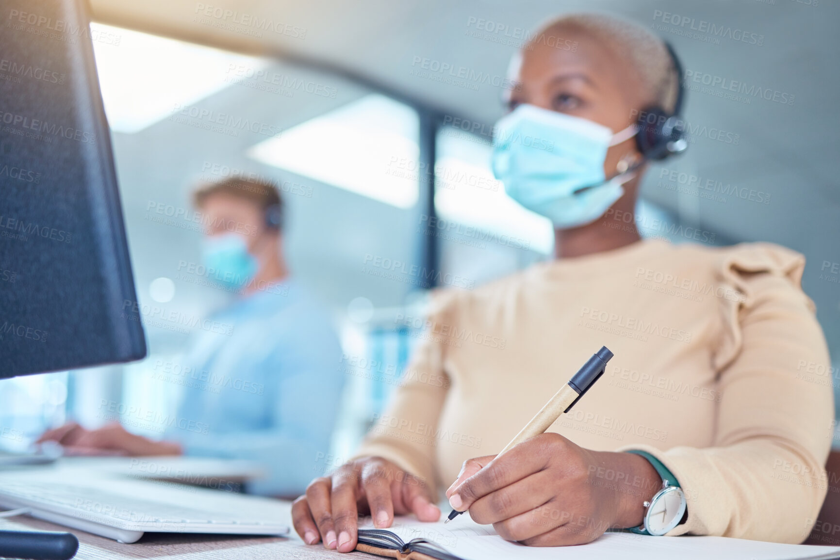 Buy stock photo Writing, documents and covid of a woman with a mask while at work in customer support in a call center. Female contact agent in telemarketing helping client and taking notes on a desk at the office.