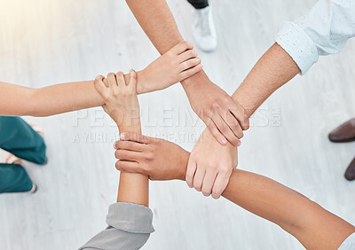 Buy stock photo Hope, partnership and support group holding each other at community therapy session. Top view of people doing motivation, love and trust exercise while building a connection at mental health clinic.