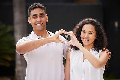 Buy stock photo Happy couple buy real estate with key and heart hand sign and a smile together. Man and woman with keys or happiness with property rent or purchase of house, family home or apartment with love