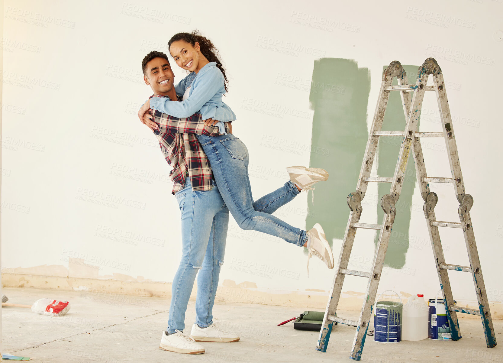 Buy stock photo Love, a mortgage and a new home, couple paint a wall in a house green. Security, home finance and investment, a happy marriage and family fun. New beginning and bright future for young man and woman.
