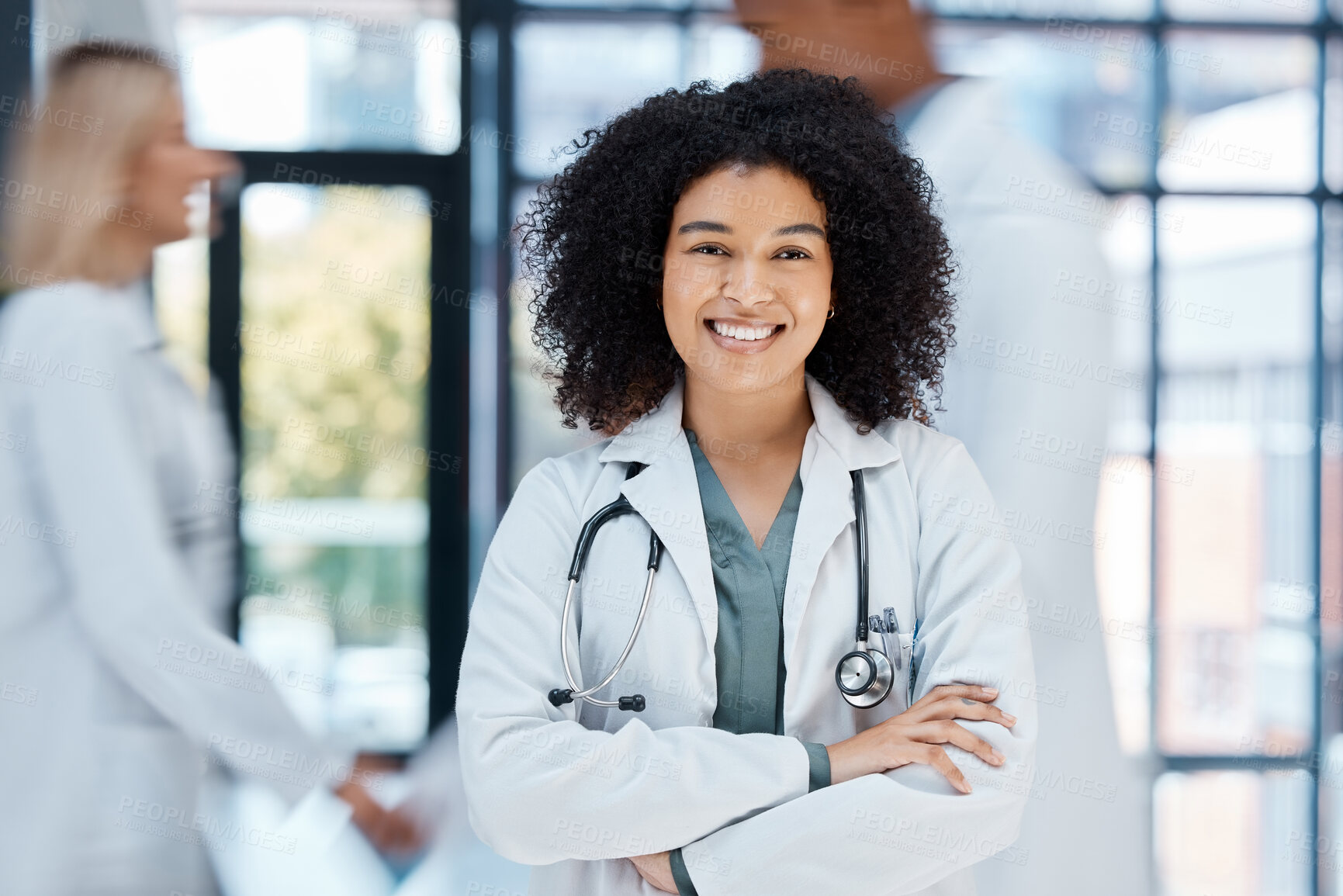 Buy stock photo Portrait of happy doctor with smile in a hospital ward with motivation and success in the medical industry. African american healthcare expert or worker proud and confident in help make a difference