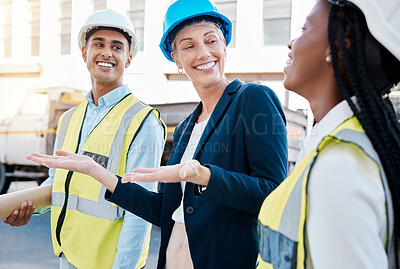 Buy stock photo Construction worker, female architect and engineer working as a team on project maintenance on a building site in the city. Teamwork, collaboration and success in the architecture and design industry