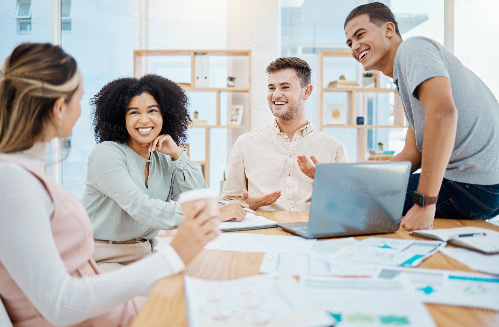 Buy stock photo Happy business people laughing and enjoying a casual chat in an office, taking a break from paperwork. Diverse work friends bonding and talking about a funny story, smiling, listening and chilling