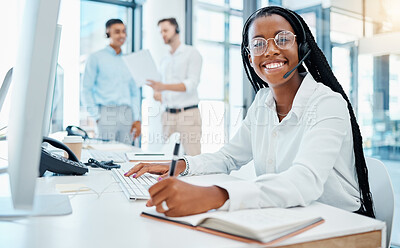 Buy stock photo Contact us, crm and online support by call center agent writing note and help customer in office. Smiling black operator enjoy communication and giving expert advice, being friendly and professional