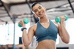 Happy, health and fitness, a woman with dumbbells and a weight training workout. Exercise and beauty, female body builder with a smile in sports gym. Healthy, wellness and lifestyle of a girl athlete