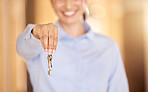 Key, property and real estate or realtor woman hands with success, happiness and trust on bokeh. Smile of a happy professional agent, business person seller with keys for apartment, rent or mortgage