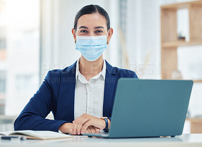 Buy stock photo Compliance, face mask and covid rules at work with a business woman working on a laptop in a corporate office. Portrait of a female practice social distancing at workplace, regulations and hygiene