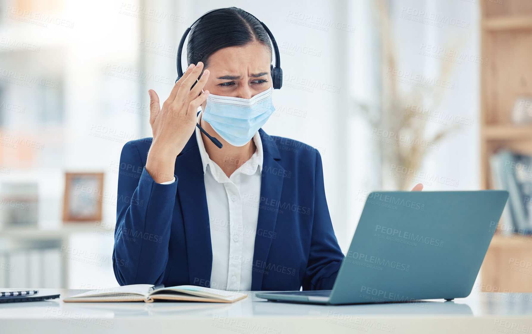 Buy stock photo Headache, pain and tired call center agent working on a laptop with headset while wearing face mask. Stressed, burnout and frustrated customer service woman working on computer in a corporate office 