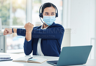 Buy stock photo Call center, customer service and telemarketing agent stretching with a mask in an office. Consultant or online support worker prepaint to work at a desk on a laptop in a sales company or center