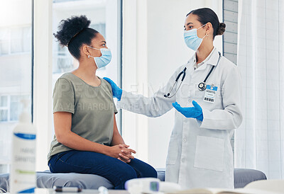 Buy stock photo Medical nurse consulting a patient for covid before vaccine while wearing a face mask during pandemic. Healthcare worker with stethoscope discussing the virus injection with a woman in hospital room.