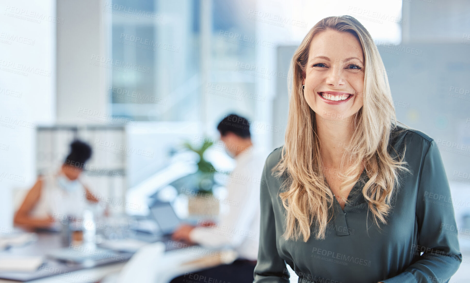 Buy stock photo Female leader, manager or CEO with a smile, mission and vision in the office and her team in the background. Leadership, management and success with a woman boss and corporate business people at work