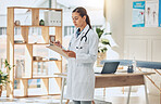 Doctor writing analysis, reading test results and consulting document information in wellness clinic. Hospital woman, notes and medicine research for healthcare, surgery planning and medical service