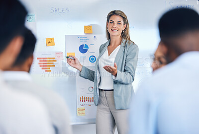 Buy stock photo Sales, marketing and b2b strategy of business woman speaker giving a presentation to work crowd. Corporate advertising seminar with female present sale analytics and logistics chart on white board