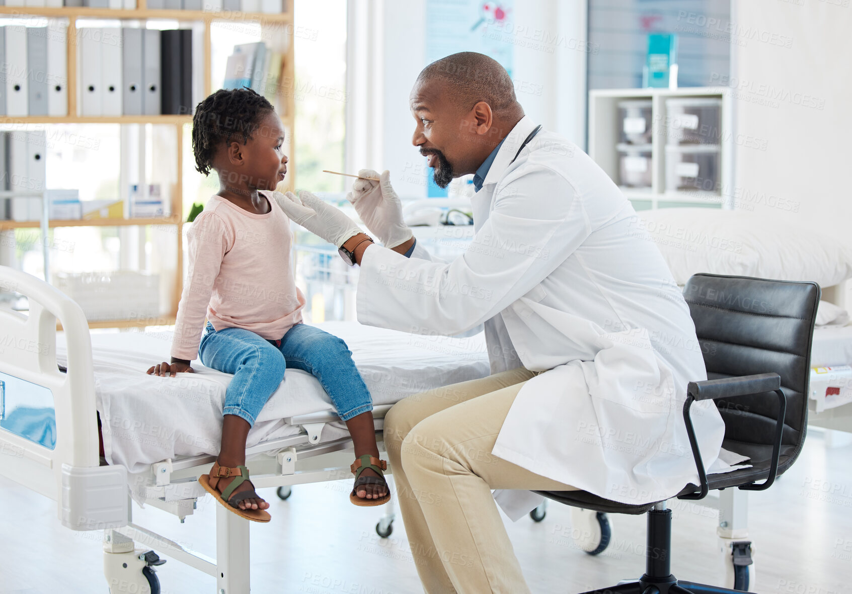 Buy stock photo Doctor, mouth of child and black man helping little girl in checkup or consultation at a hospital. Medical male expert or pediatrician examining kid for throat infection, illness or sore in clinic.