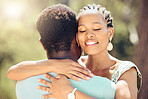 Love, relax and happy couple hug in nature for a save the date wedding announcement photo. Young man and woman from Jamaica in the summer sunshine to show romance, trust and romantic partnership