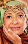 Face, beauty and jewelry on egyptian woman with hands on face for arab culture with hands on face for fashion and skincare. Portrait of a mature muslim female from Egypt with makeup and cosmetic