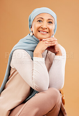 Buy stock photo Hijab, fashion and senior Muslim woman with a smile, confidence and happiness on a brown studio background. Islam, happy and face portrait of an Arab, Islamic and modest elderly model with style