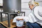 Beekeeper woman, honey production and machine in factory, workshop and organic harvesting process. Apiculture expert, natural product and working with ppe bee suit for manufacturing healthy food