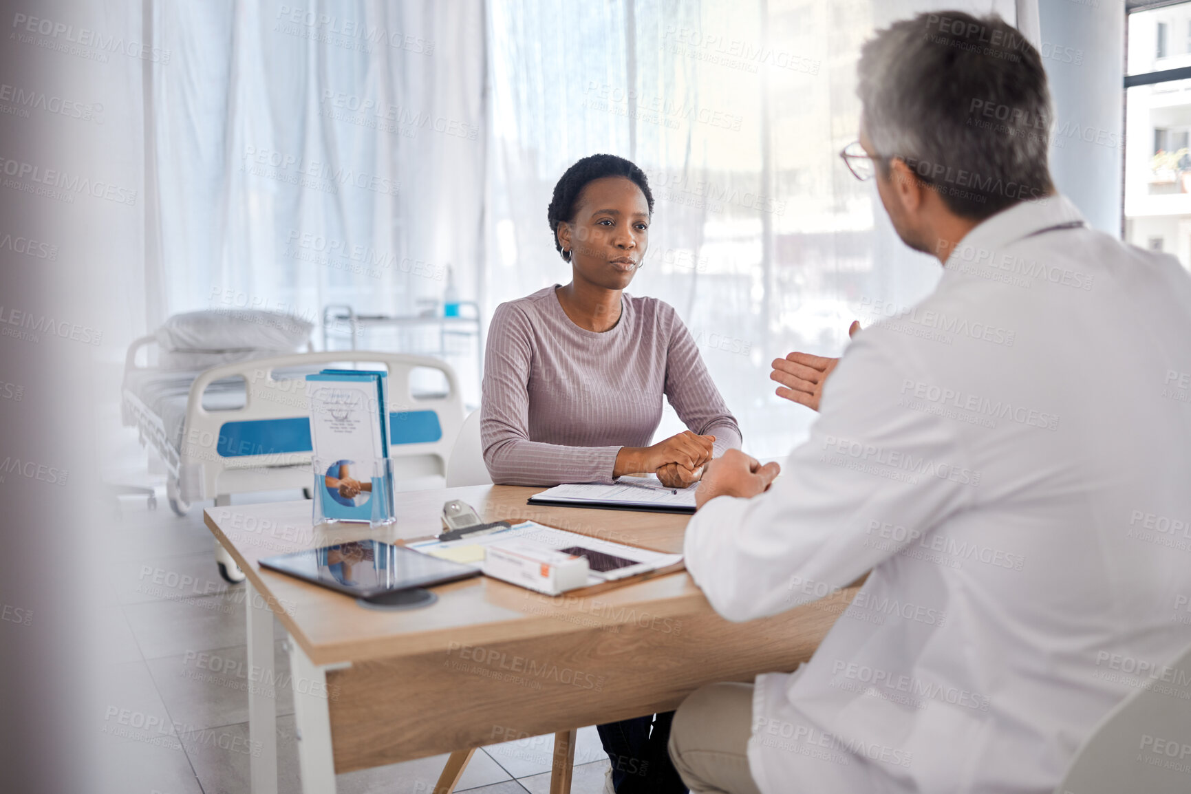 Buy stock photo Healthcare, doctor and woman consulting for insurance, help and paperwork in consultation room. Health expert, black woman and discussion with documents for compliance before surgery in a hospital