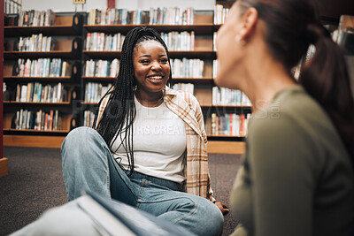 Buy stock photo University, students and friends on library floor for studying, education and learning together. Happy black girl, gen z youth and college student at academy, campus and school in room with bookshelf