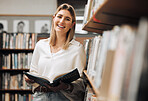 Student, reading or books in library on school, university or college campus for education, study research or learning. Portrait, smile or happy woman, textbook or bookshelf information for homework
