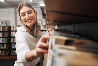 Buy stock photo Library books, student and woman packing textbook in a education, university and learning book shop. School, college and happy graduate looking for knowledge, studying and learning with a smile