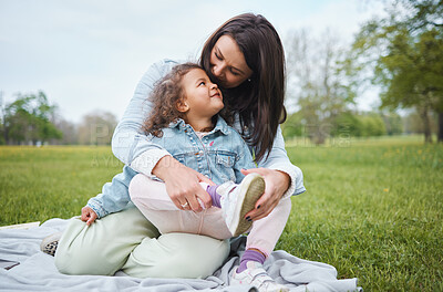 Buy stock photo Love, mother and girl on blanket at park, having fun and bonding. Care, family and happy mom embrace with 
daughter at garden, smiling and enjoying quality time together outdoors in nature on grass.