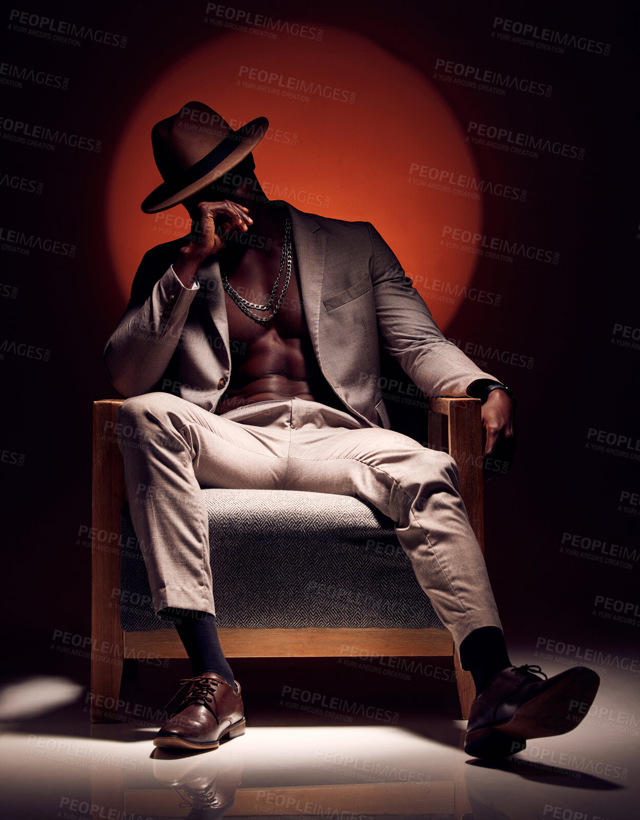 Buy stock photo Suit, formal and fashionable model with class, style and fashion in studio showing abs and body muscle with shadow. Artistic man in trendy, elegant or cool clothing showing power against background