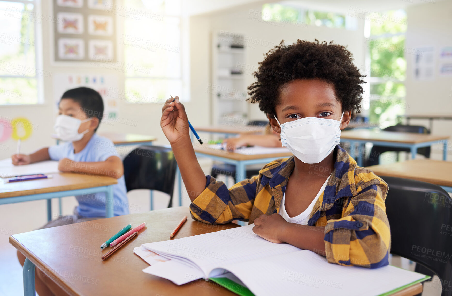 Buy stock photo Child or student in class during covid, wearing a mask for hygiene and protection from coronavirus flu. Portrait kindergarten, preschool or elementary school boy sitting in a classroom ready to learn