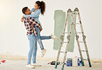 Love couple smile painting house or home interior with paint and ladder for DIY room project and maintenance. African creative and painter black people happy working on apartment wall design together