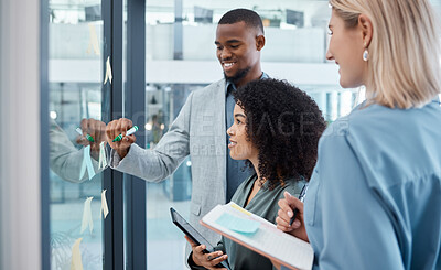 Buy stock photo Teamwork, planning and collaboration strategy with a team working on glass wall with stick notes in an office. Diversity, writing and creative analytics workers in business meeting thinking of idea
