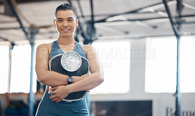 Buy stock photo Fitness, health and exercise by woman holding scale and looking happy with results of diet and balance lifestyle. Happy female enjoying benefits of training and weight loss at a gym or fitness center