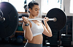 Fitness, workout and exercise woman with barbell in gym for health, cardio and wellness. Strength, sports and healthy bodybuilder or athlete training for weight power lifting and muscle competition

