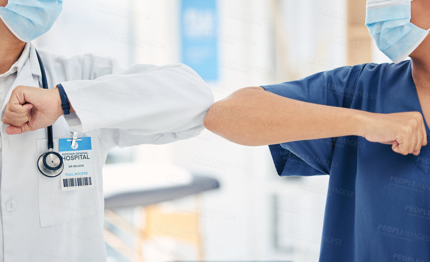 Buy stock photo Doctor and nurse greeting with elbow to stop covid spread in a hospital while collaboration, thank you or welcome. Healthcare teamwork, support and support in a medical facility with mask for safety 