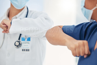 Buy stock photo Covid handshake of a nurse and doctor as a surgery success, welcome or support gesture. Medical and healthcare workers working in a hospital, wellness clinic of doctors office greeting at work