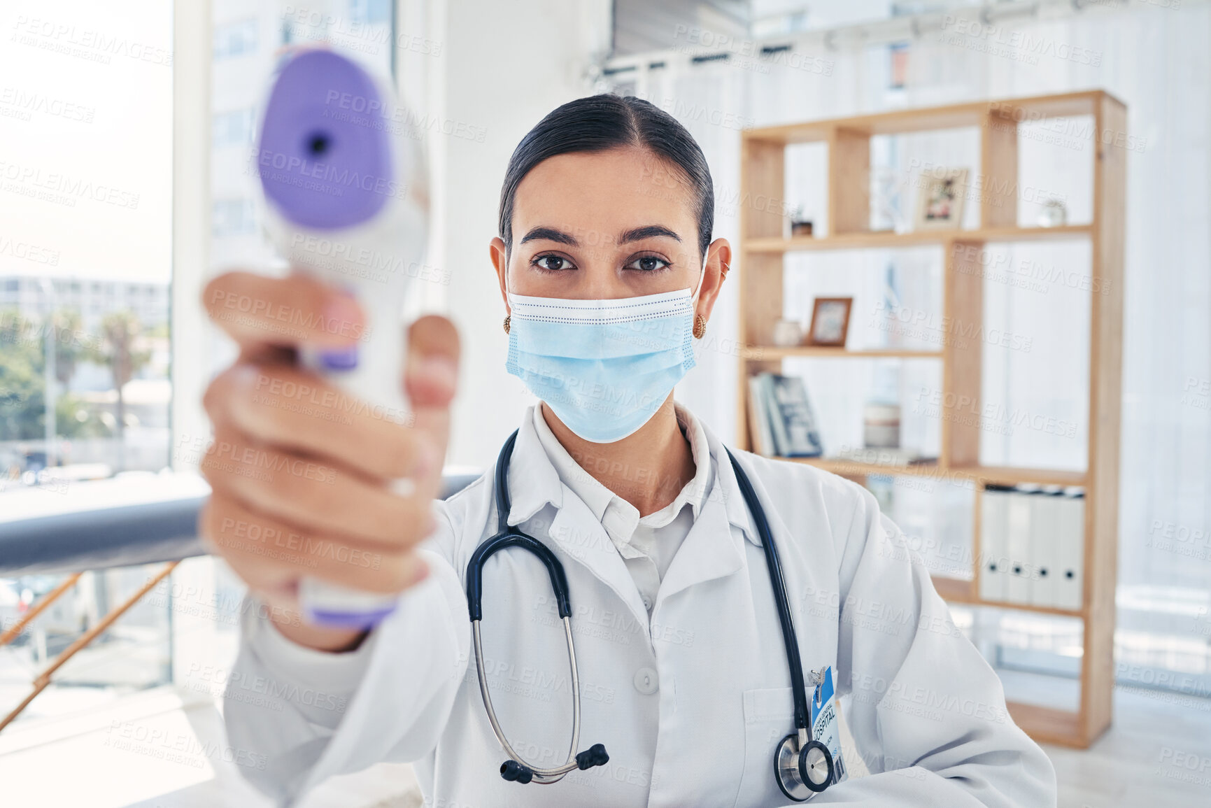 Buy stock photo Covid doctor thermometer, safety check and corona virus risk in hospital, clinic and medical surgery. Portrait of healthcare worker consulting with face mask, wellness service test and fever laser