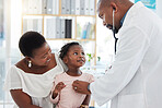 Heart doctor, mother and child at a hospital for checkup, examination or medical advice at a clinic. Black healthcare man in cardiology checking little girl patient in medicare, examine appointment.