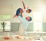 Happy black father and daughter playing in a kitchen while cooking together, bonding and laughing. African American parent enjoying family time with his child, playful and having fun while baking