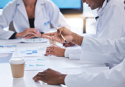 Buy stock photo Team of doctors consulting in meeting with paperwork of graphs, data and charts in hospital conference. Healthcare staff discussing health statistics, results and strategy in medical clinic office.