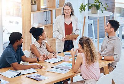 Buy stock photo Female leadership, teamwork and planning during a meeting to explain business strategy, vision and mission at table with team diversity. Group of employees listen to boss talk about financial report