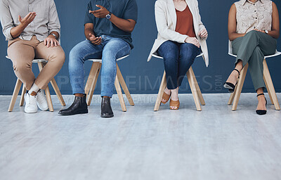 Buy stock photo Interview, human resources and recruitment with business people sitting in line on chairs in a studio or waiting area. Entrepreneur application and hiring for a vacancy at a small startup company