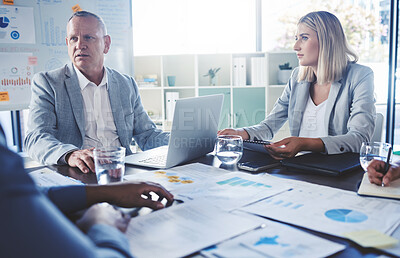 Buy stock photo Serious people in business meeting discussion, planning strategy for company financial report with charts, graph and data. Team manager man and woman listening to review of corporate marketing growth