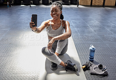 Buy stock photo Woman taking selfie with phone at gym, talking on video call with smartphone before workout for fitness training and happy with conversation on tech before exercise. Athlete in conversation at club