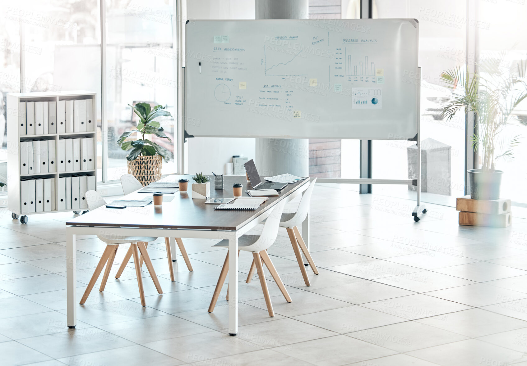 Buy stock photo Boardroom, meeting or empty conference room with whiteboard, chairs and table interior of modern creative office space. Marketing data and charts for a business presentation, discussion of briefing