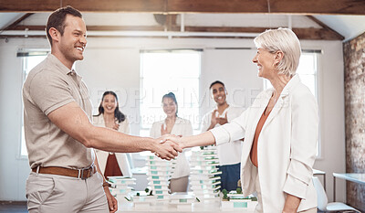 Buy stock photo Architect, business handshake and partnership meeting of people in agreement for architecture plan at the office. Happy senior woman and young man shaking hands in collaboration at work for teamwork