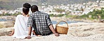 Couple, love and beach picnic for black woman or man on summer South Africa holiday near sea, water or ocean city. Safety, trust or security with zen people and view on nature rock on travel vacation