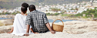 Buy stock photo Couple, love and beach picnic for black woman or man on summer South Africa holiday near sea, water or ocean city. Safety, trust or security with zen people and view on nature rock on travel vacation