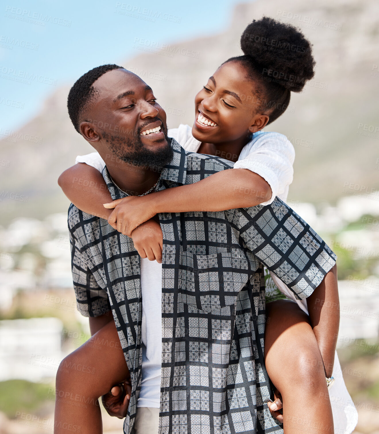 Buy stock photo Love, happy and relax couple on beach date while on travel vacation, holiday or romantic summer honeymoon getaway. Support, romance and partnership for married black man carrying woman on Brazil trip